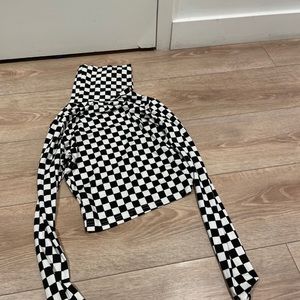 Checkered black and white turtleneck crop top.